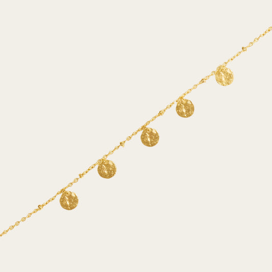 Alceste gold plated Bracelet on neutral flat lay surface