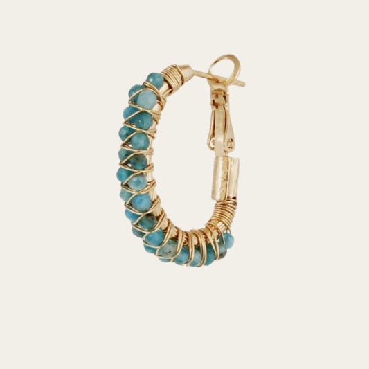 Gas bijoux lyre earring on white background