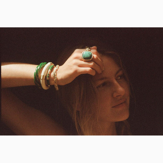 Positano bangle amongst bangles stack on model available at The Artemis Edit