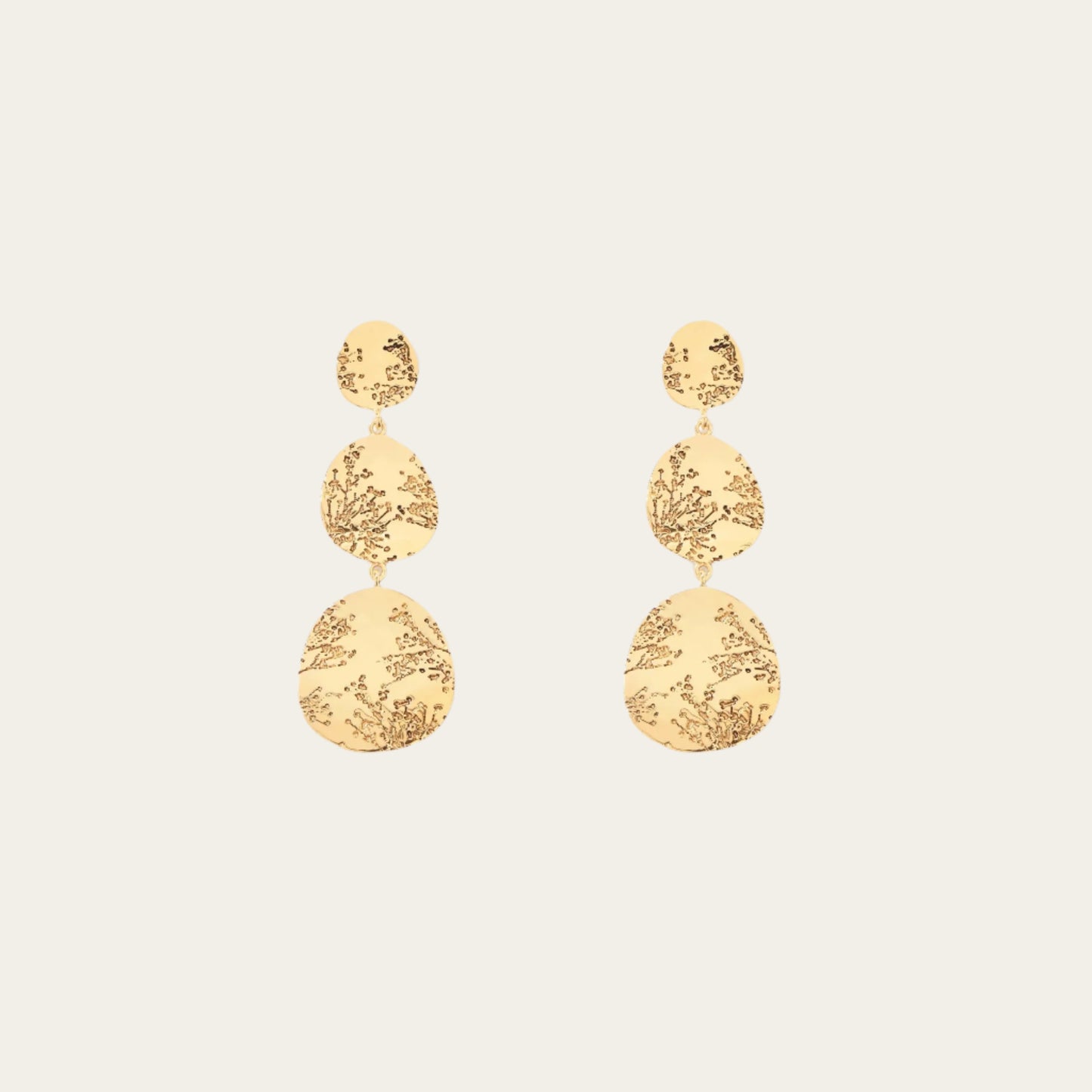 Aurelie Bidermann 3 tier hermione earrings on flat lay