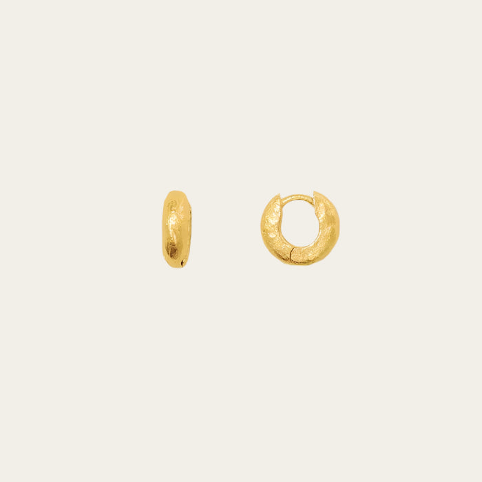 mini gold hoops on neutral background