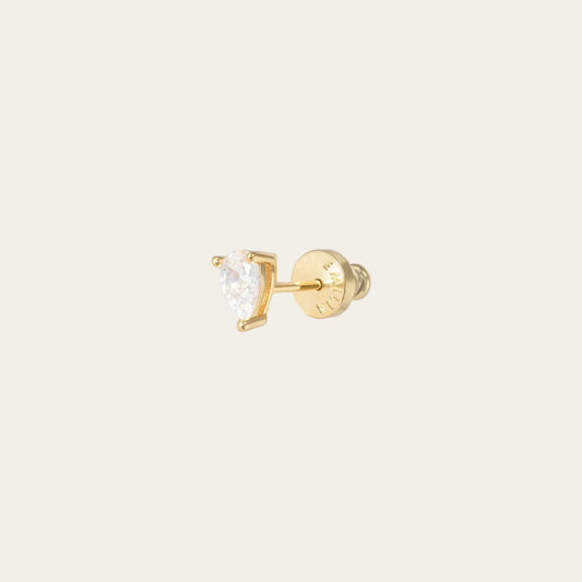 Gold stud earring with a clear gemstone on a white background