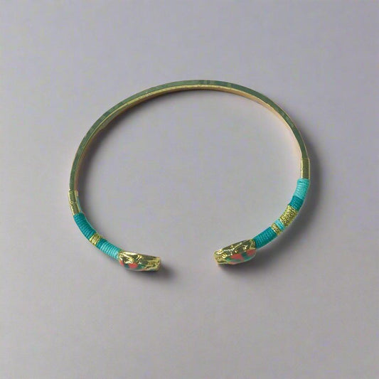 gas bijoux gold plated bangle with green and pink flat lay on neutral background