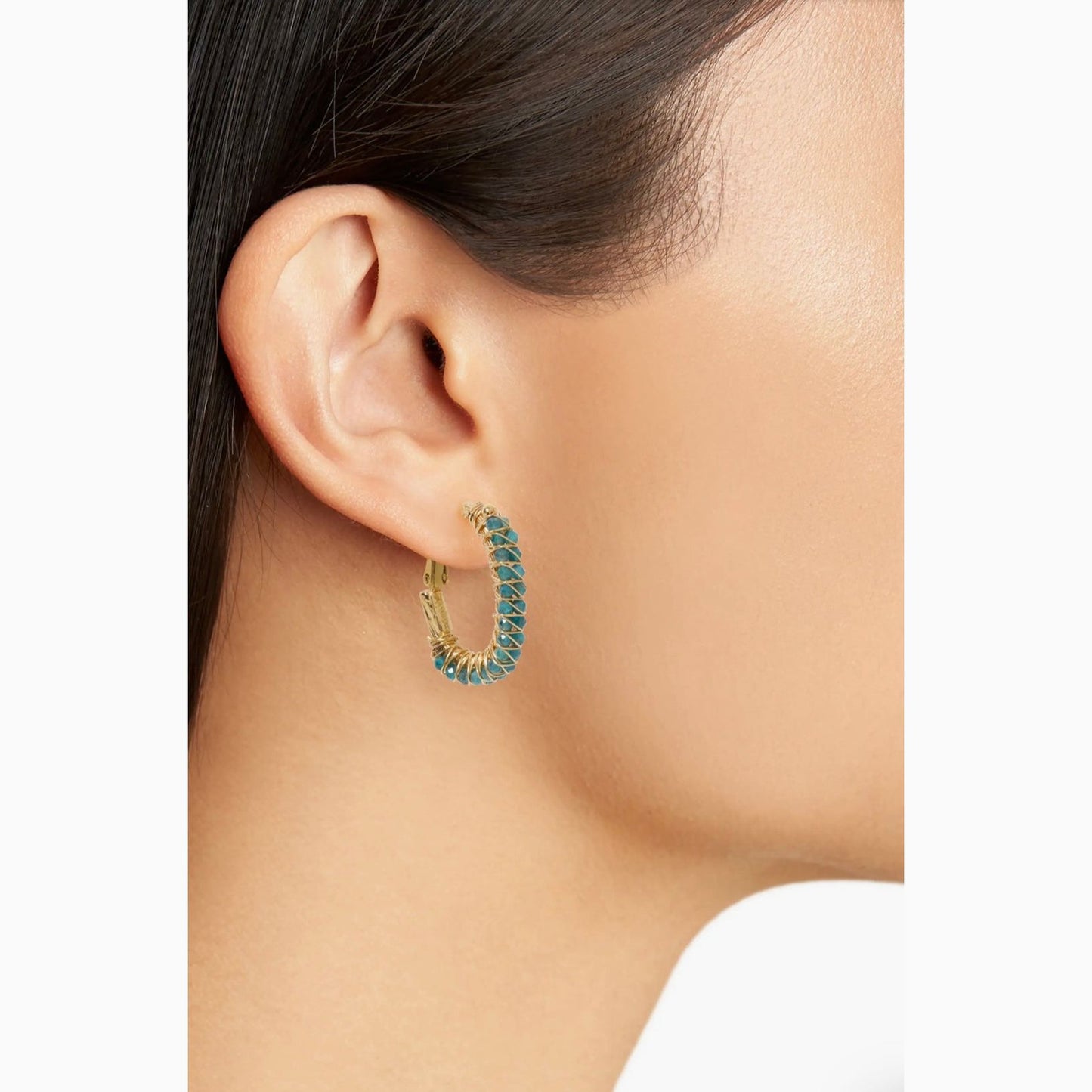 Gas Bijoux Lyre earring close up on womans ear