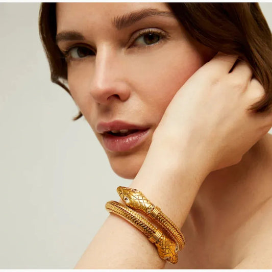 gold cobra bracelet worn on model