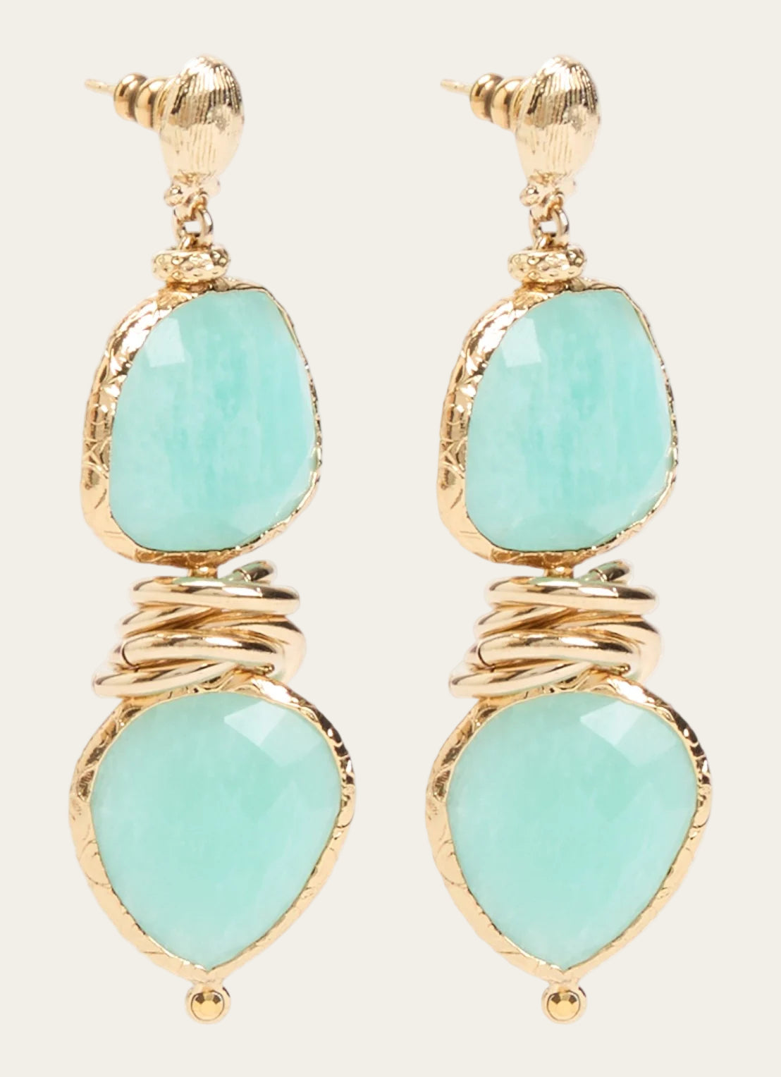 Drop earrings with gold and turquoise stones on a white background