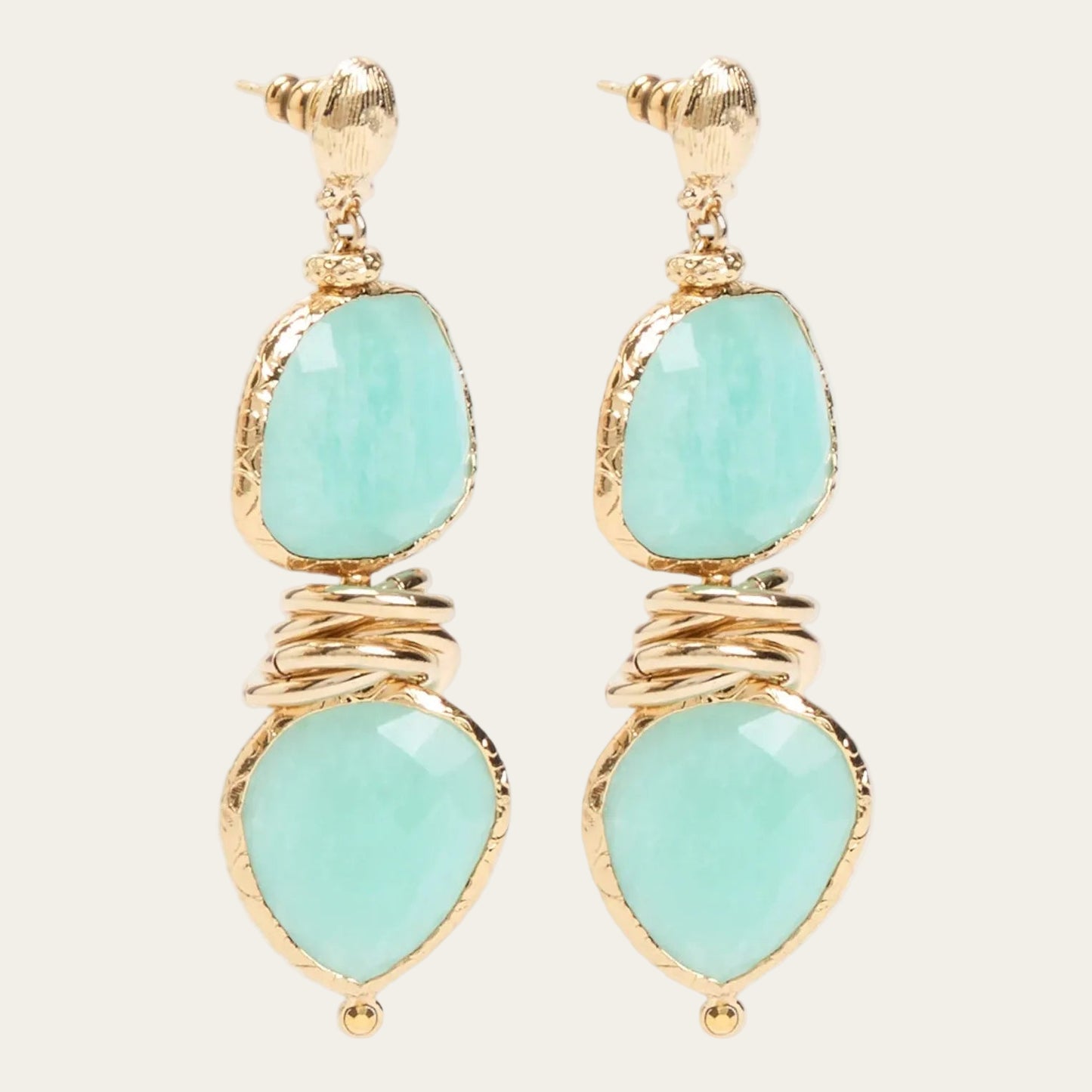 Drop earrings with gold and turquoise stones on a white background