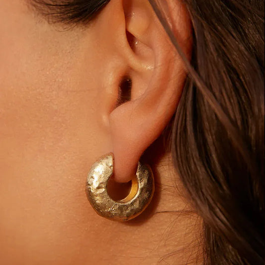 agapee gold medium anilla earrings close up on model