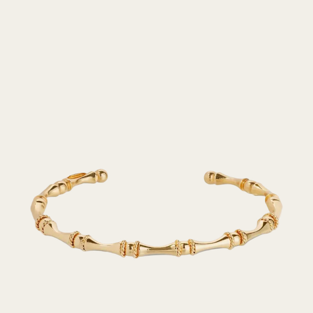 Gold bracelet on a white background