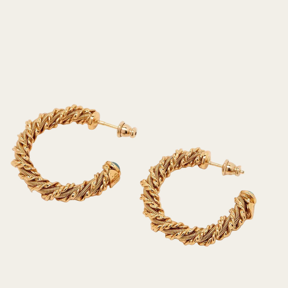 Gold hoop earrings on a white background