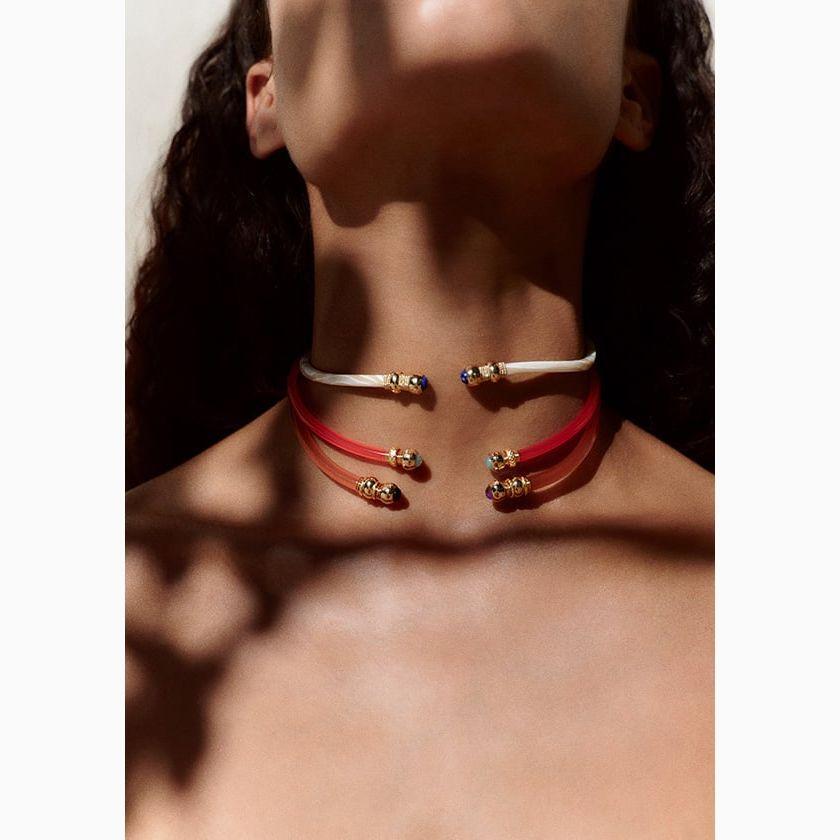 3 coloured acetate choker necklaces on model with shadows