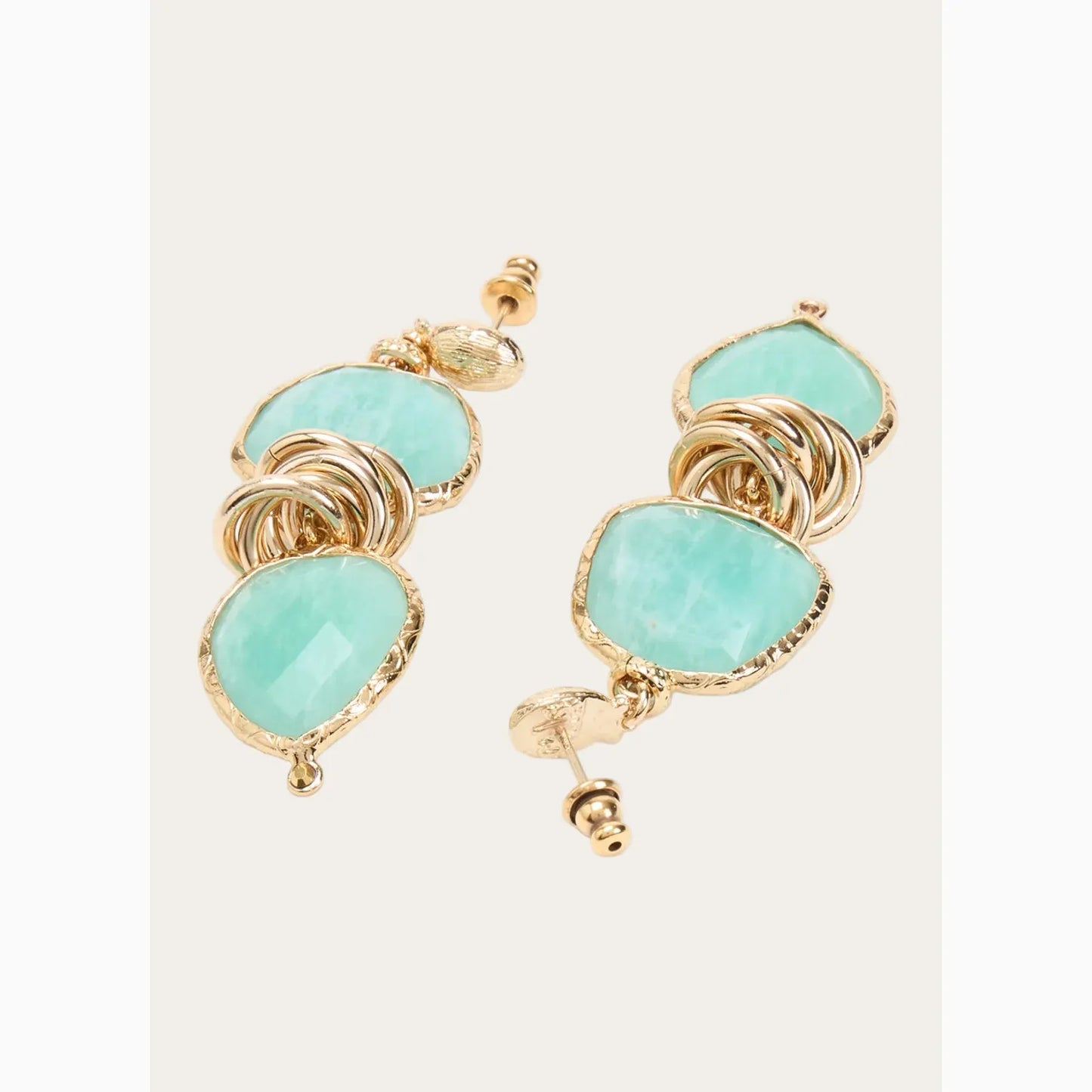 Gas Bijoux earrings with gold and turquoise stones on a white background