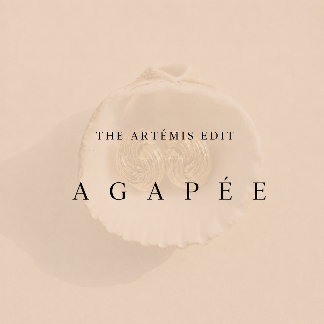 earrings in a shell with agapee writing