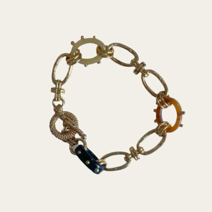 Bracelet from24K gold-plated material,  Acetate link chunky bracelet on flat lay.
