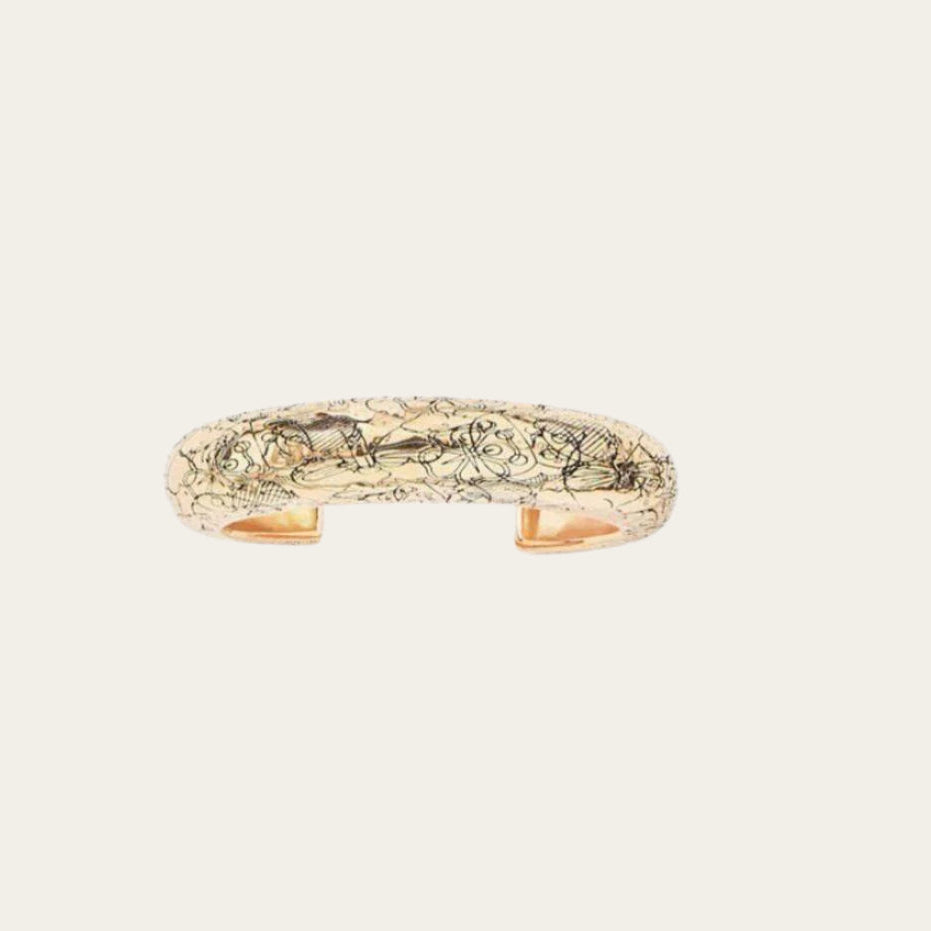Aurélie Bidermann Rosalba cuff bracelet, crafted in 18k gold brass.&nbsp; The bracelet is decorated with flowers in brass, gilded with 750/1000 yellow gold.