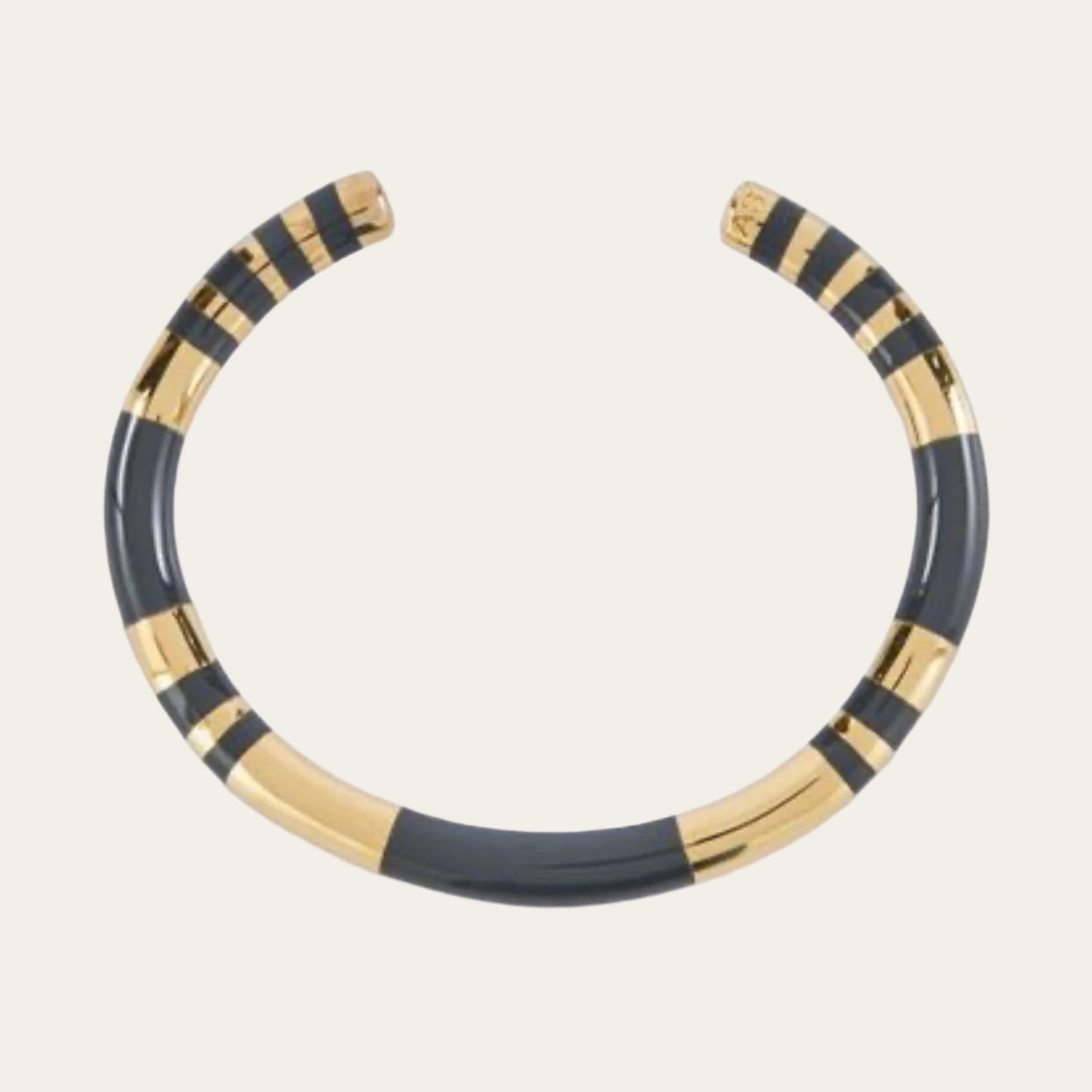Elevate your style with the Aurèlie Bidermann Positano two-tone grey resin and gold bangle, featuring a chic combination of resin and gilded 750/1000 yellow gold.
