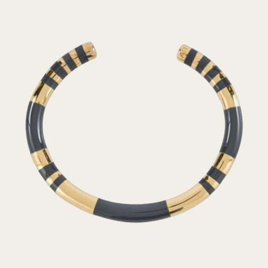 Elevate your style with the Aurèlie Bidermann Positano two-tone grey resin and gold bangle, featuring a chic combination of resin and gilded 750/1000 yellow gold.