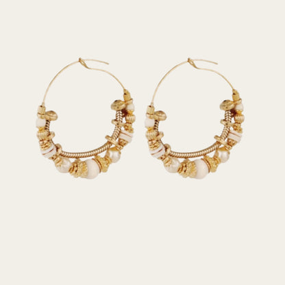gold-plated earrings adorned with sparkling gemstones and golden beads. 