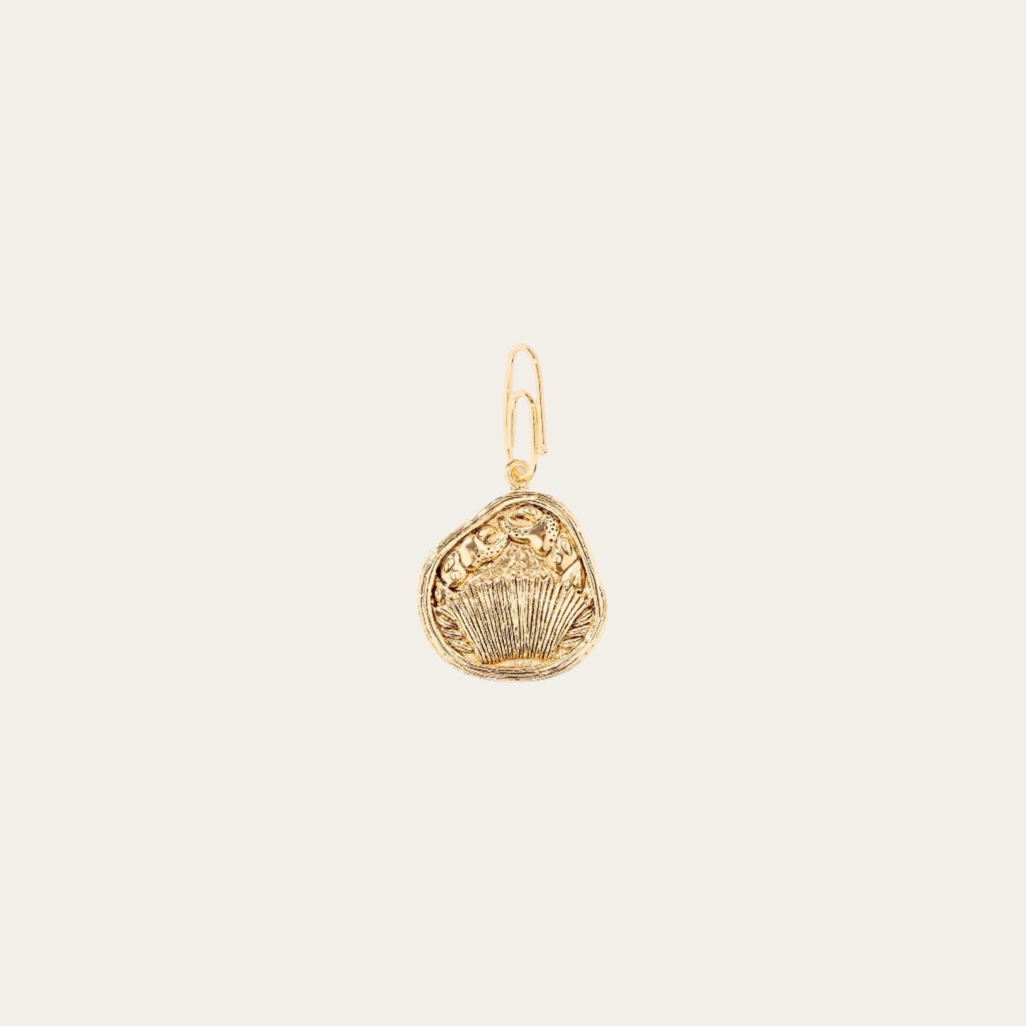 A gold-plated Cancer Zodiac charm with intricate detailing, designed by Aurélie Bidermann.