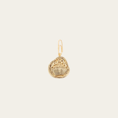A gold-plated Cancer Zodiac charm with intricate detailing, designed by Aurélie Bidermann.