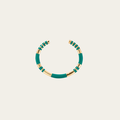Aurelie Bidermann Emerald Positano Bangle on neutral flat lay surface