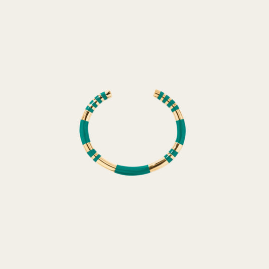 Aurelie Bidermann Emerald Positano Bangle on neutral flat lay surface