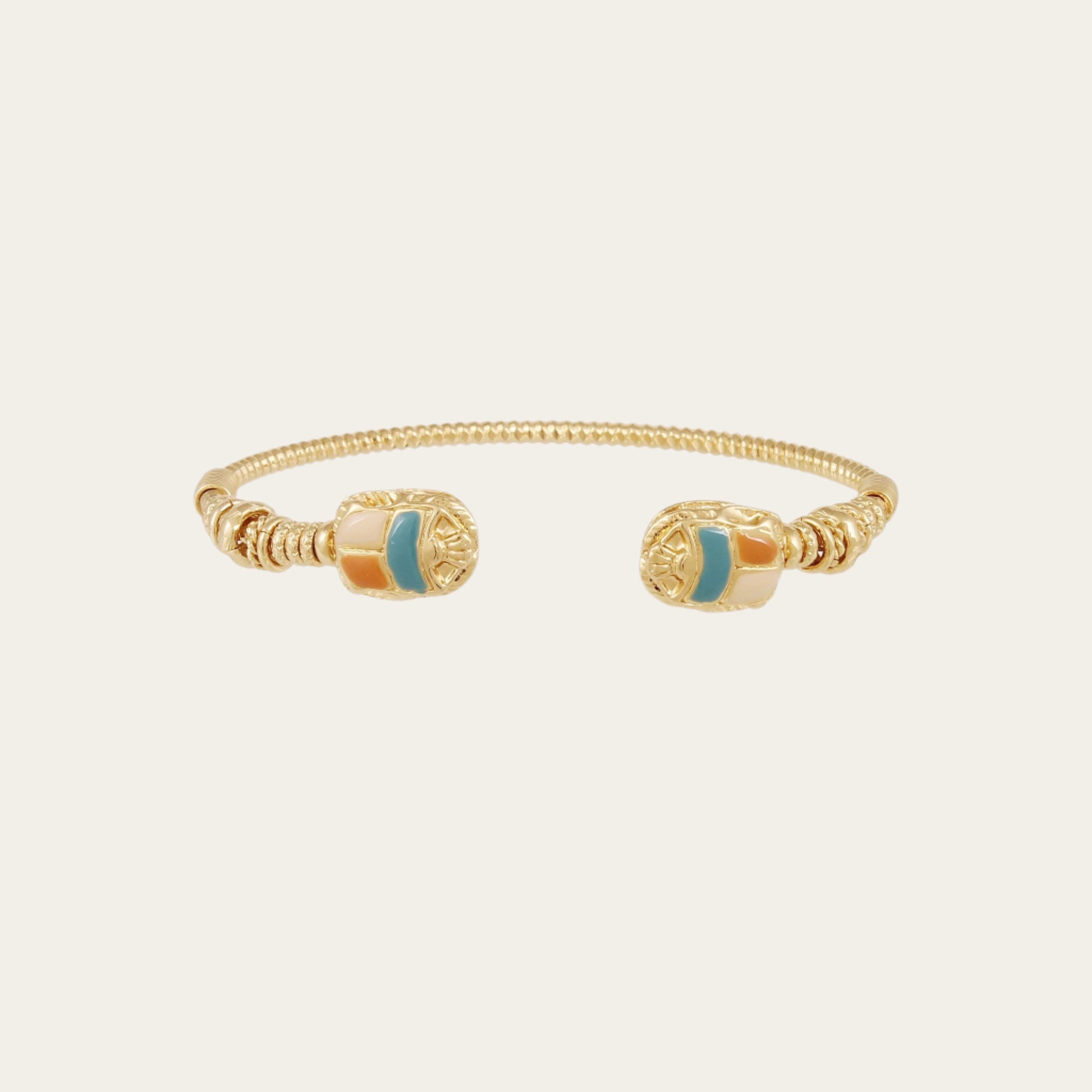 gold plated cuff against neutral background
