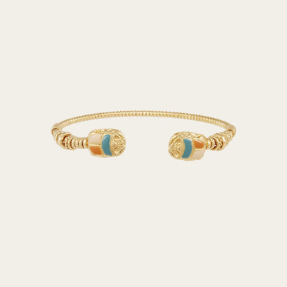 gold plated cuff against neutral background