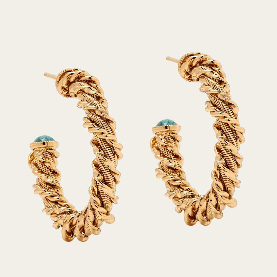 Gold hoop earrings with a textured design on a white background