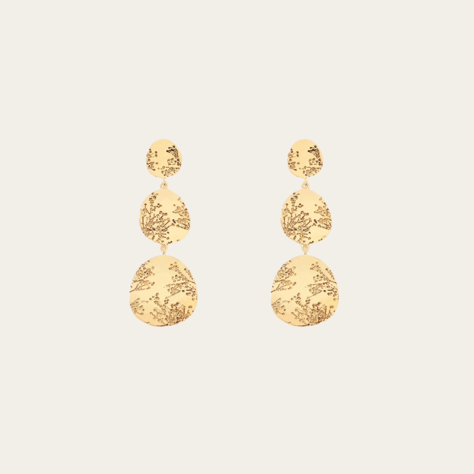 Aurelie Bidermann 3 tier hermione earrings on flat lay