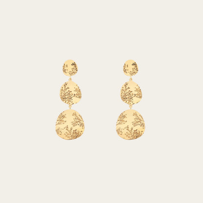 Aurelie Bidermann 3 tier hermione earrings on flat lay
