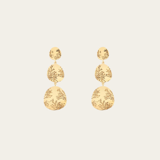 Aurelie Bidermann 3 tier hermione earrings on flat lay