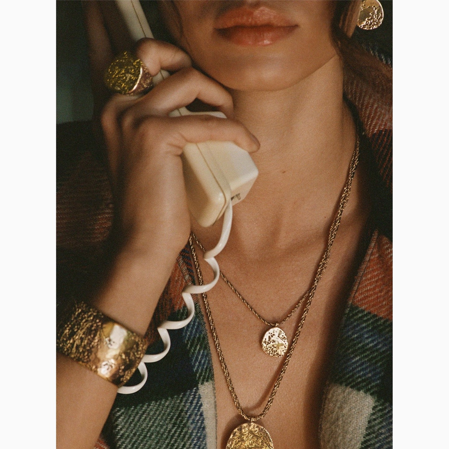 Aurelie Bidermann Hermione collection, the hermione earrings featured on a model 