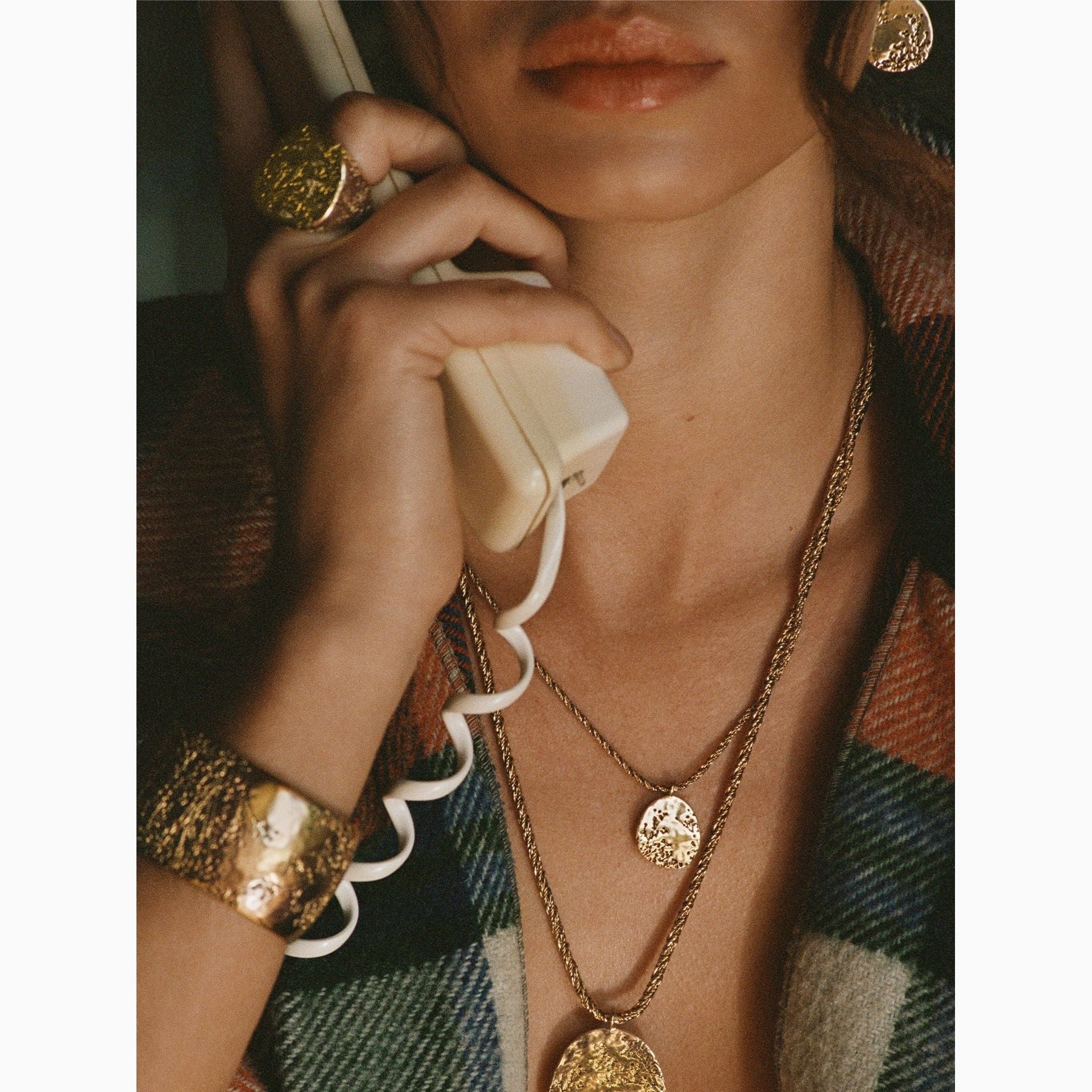 Aurelie Bidermann Hermione collection, the hermione earrings featured on a model 