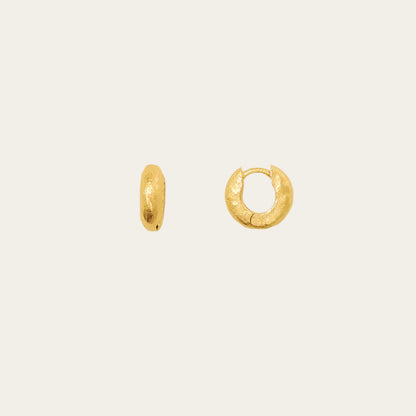 mini gold hoops on neutral background