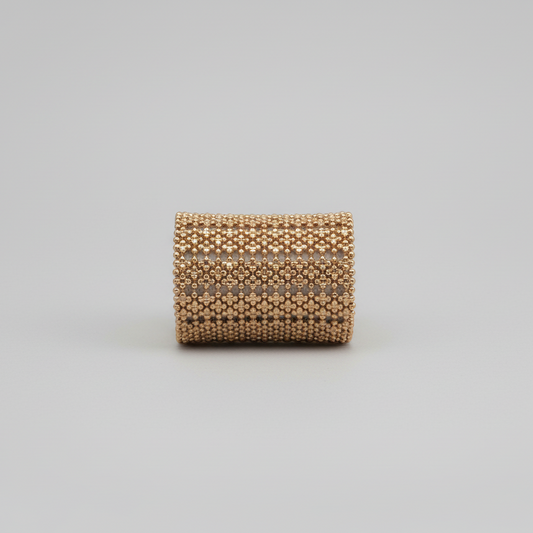 gold plated bracelet cuff on neutral background