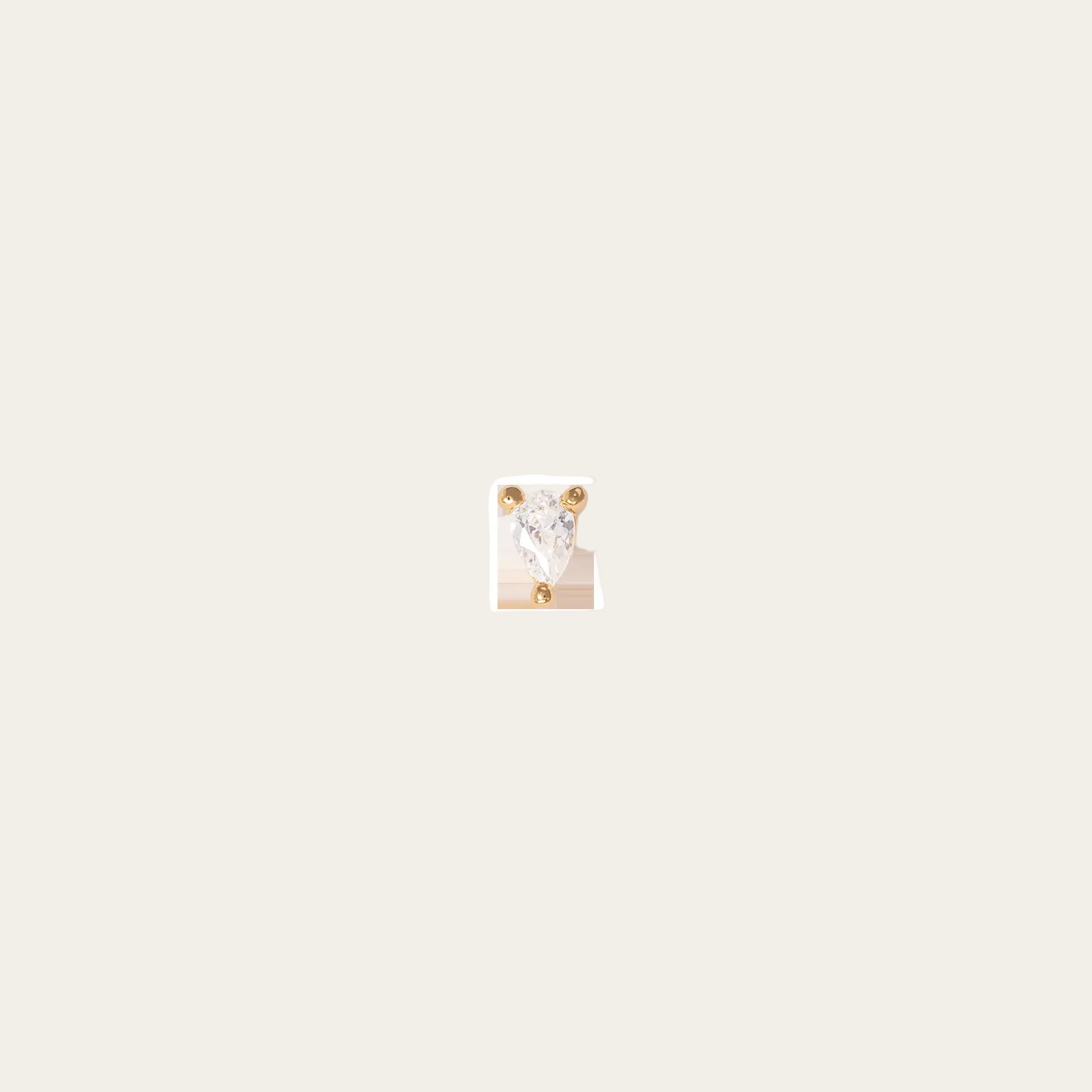 Single diamond earring on a white background