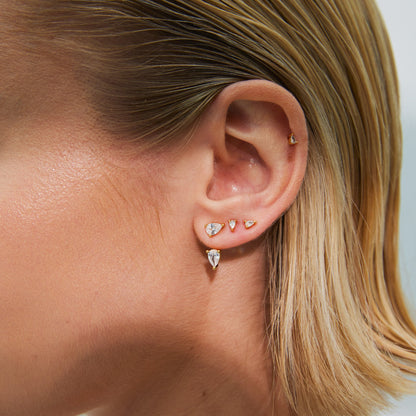 close up of womans ear stack of studs