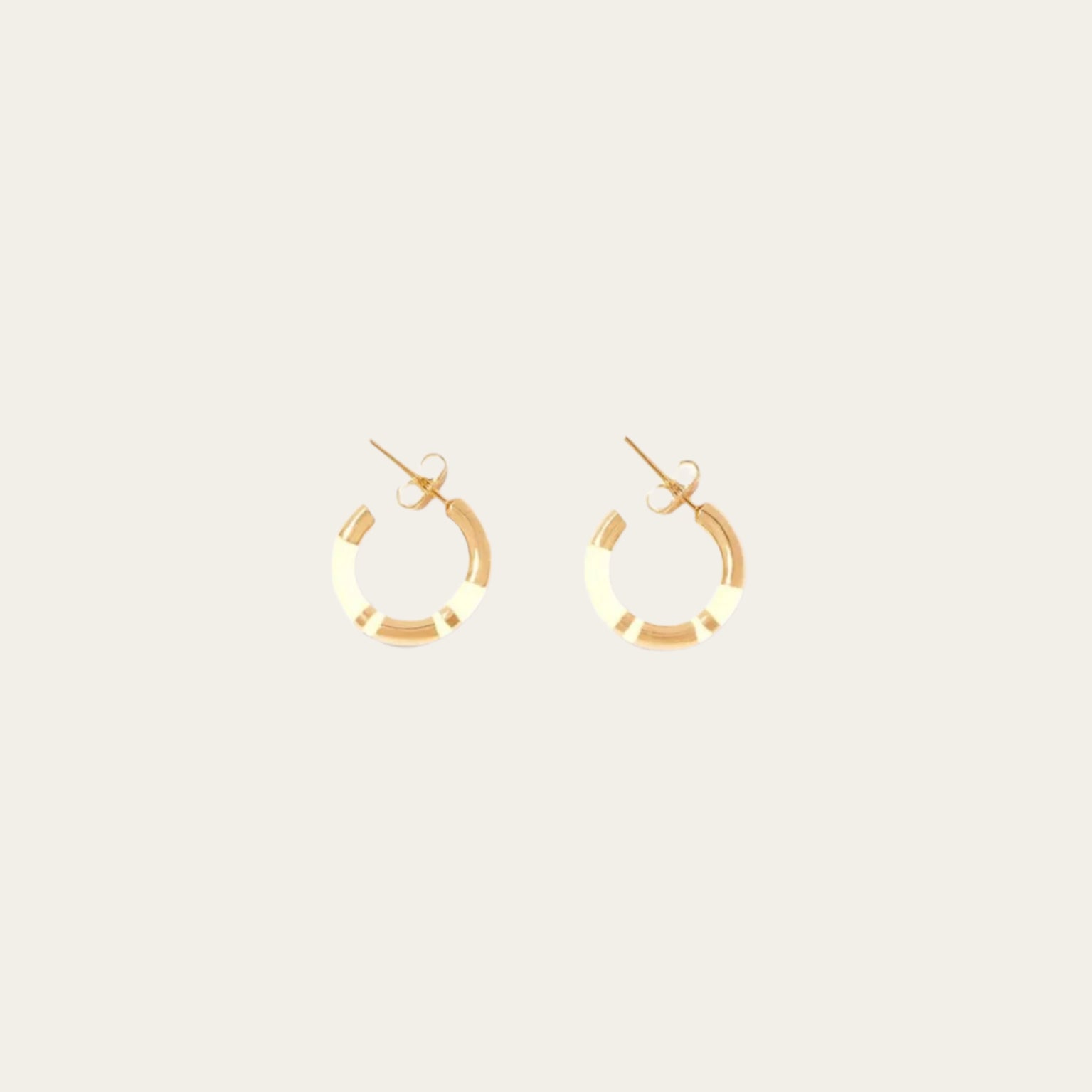 Aurélie Bidermann Positano mini hoop earrings, adorned with chic ivory stripes in resin and gilded with 750/1000 yellow gold.  