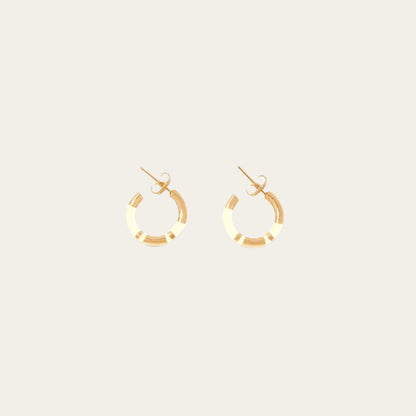 Aurélie Bidermann Positano mini hoop earrings, adorned with chic ivory stripes in resin and gilded with 750/1000 yellow gold.  