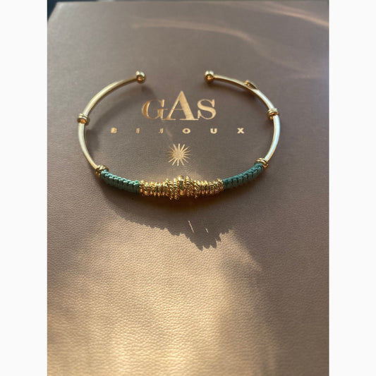 Gas Bijoux Zizanie bracelet in gold-plated finish, sculptural open cuff with twisted detail, styled on neutral background