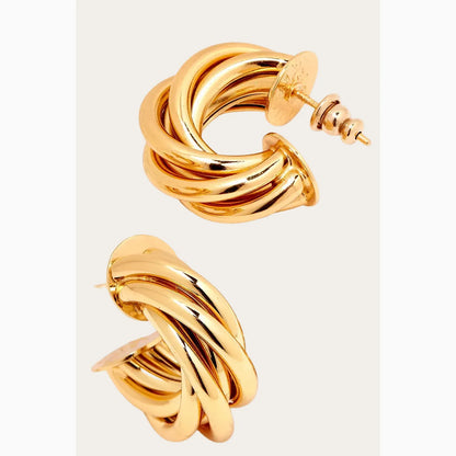 Gold hoop earrings on a white background