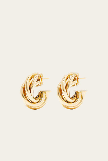 Pair of gold hoop earrings on a white background