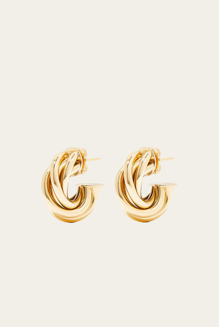 Pair of gold hoop earrings on a white background