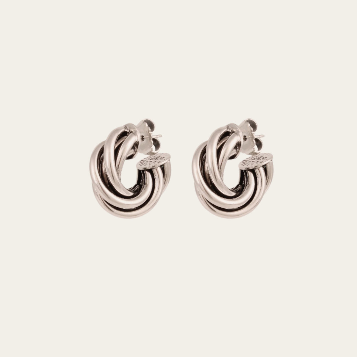 Gas Bijoux Atik Mini silver-plated earrings with intertwined hoops, shown as a pair at an angle.