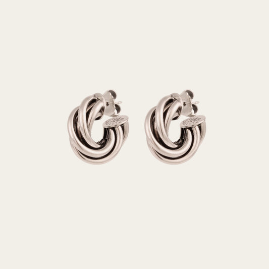 Gas Bijoux Atik Mini silver-plated earrings with intertwined hoops, shown as a pair at an angle.