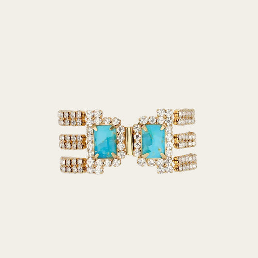 Glamorous Bracelet with turquoise stones and gold accents on a white background