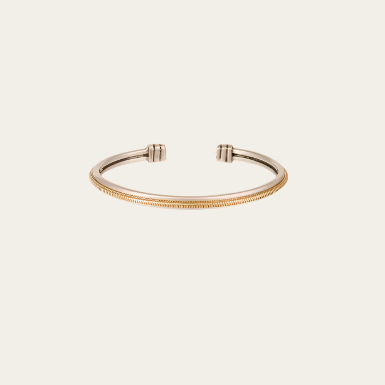 Close-up of silver-plated bangle with gold mesh centre — adjustable fit