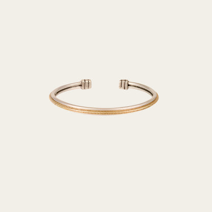 Close-up of silver-plated bangle with gold mesh centre — adjustable fit
