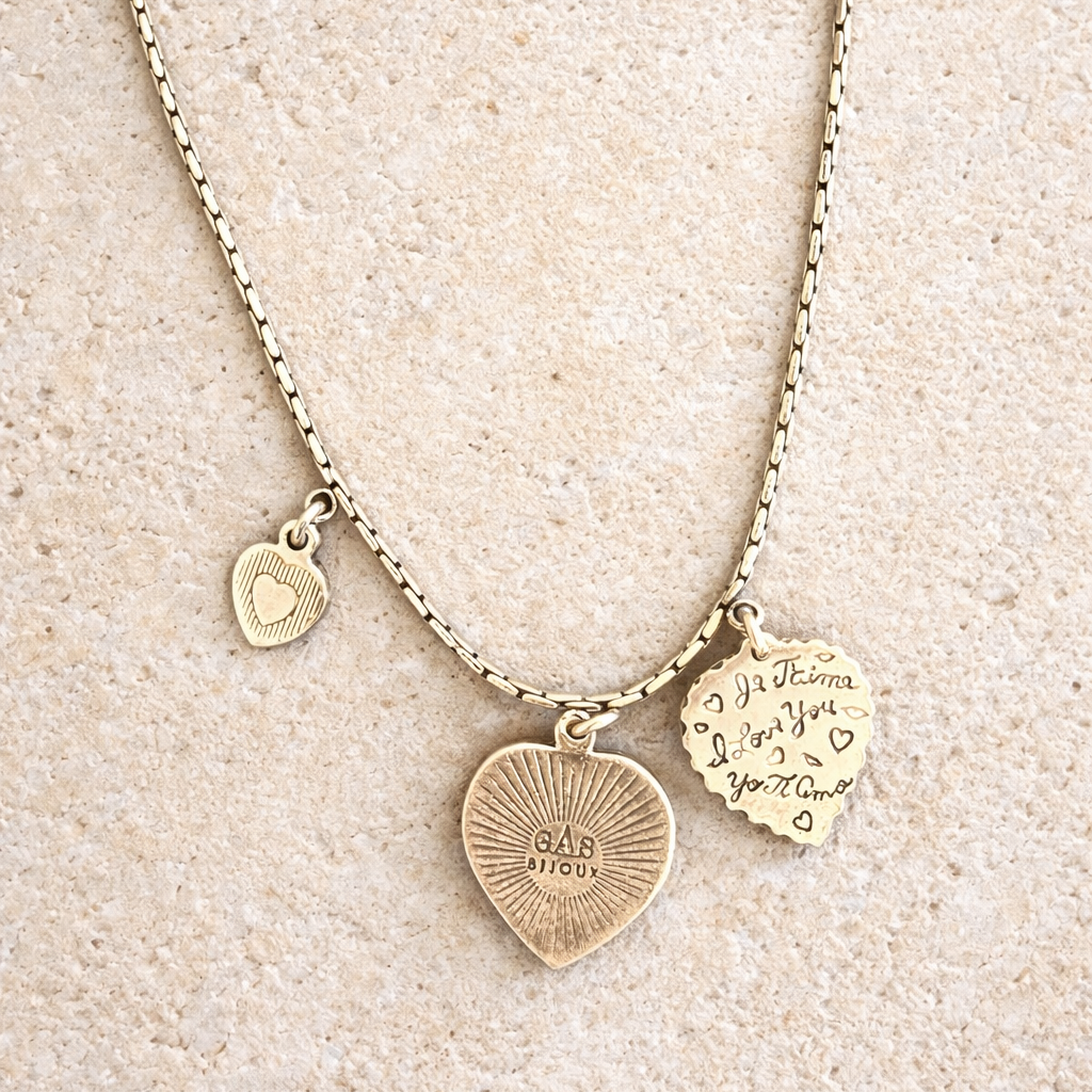 Necklace with heart-shaped charms on a beige background
